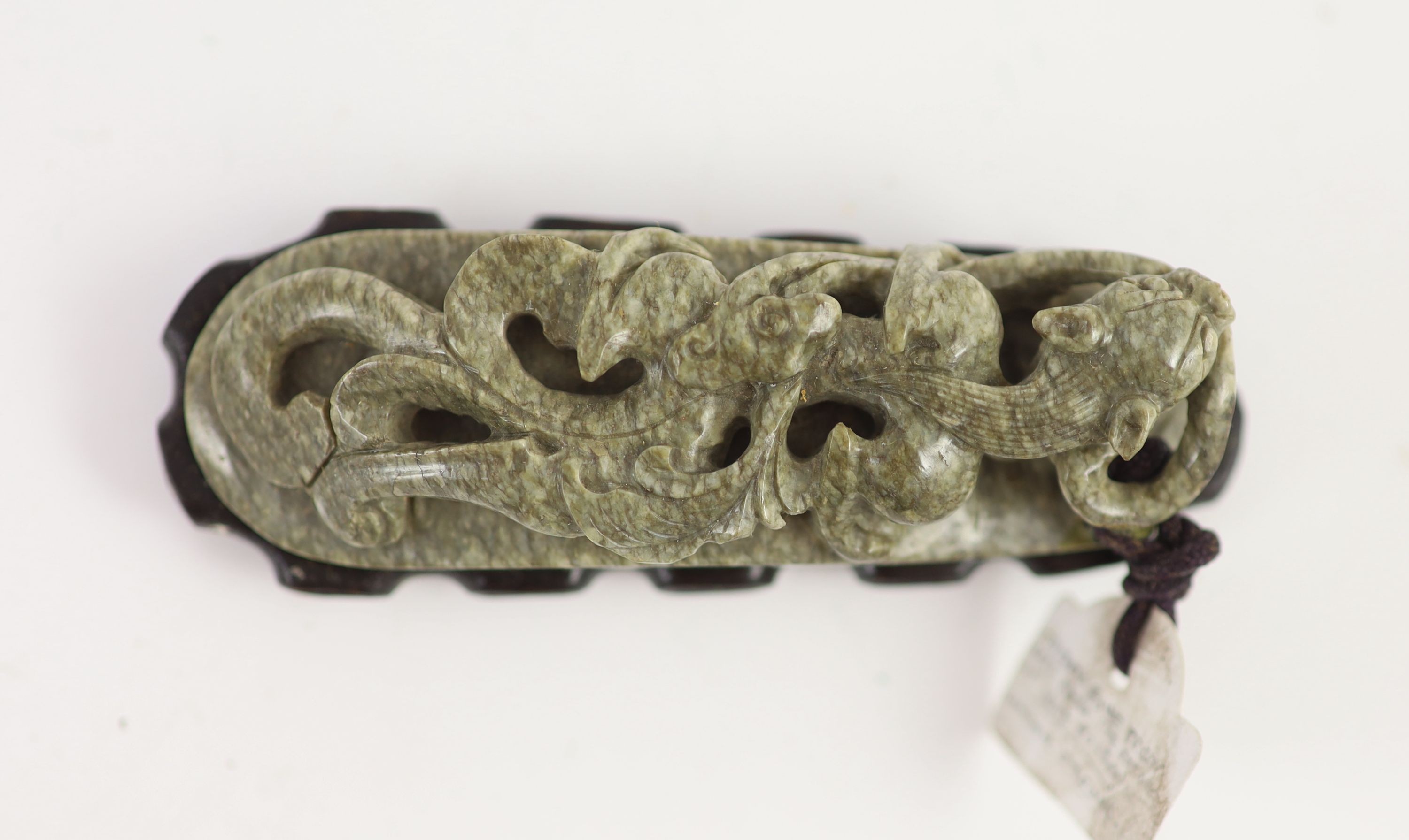 A Chinese ‘chicken bone’ jade carving, 17th/18th century 11 cm long including wood stand